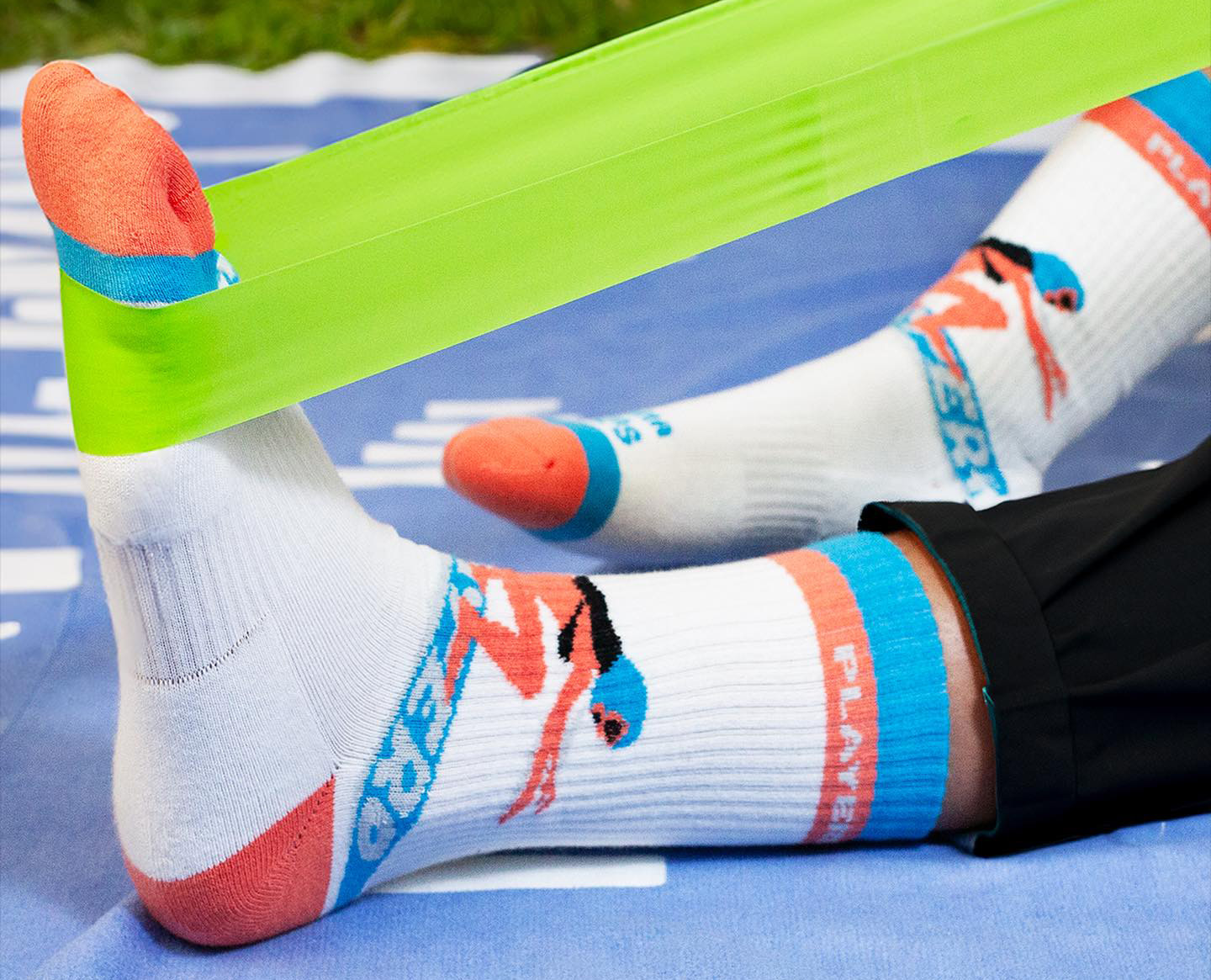 athlete stretching with custom crew socks